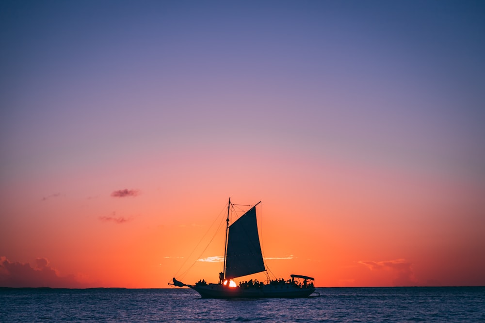 boat at the ocean during day