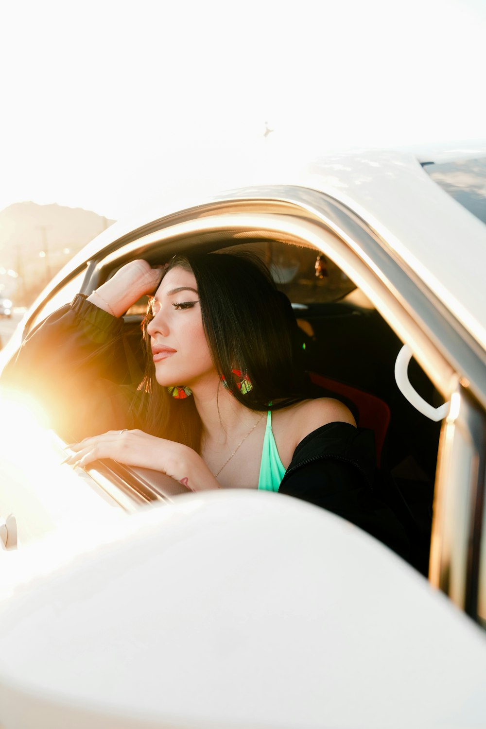 woman looking outside vehicle's window