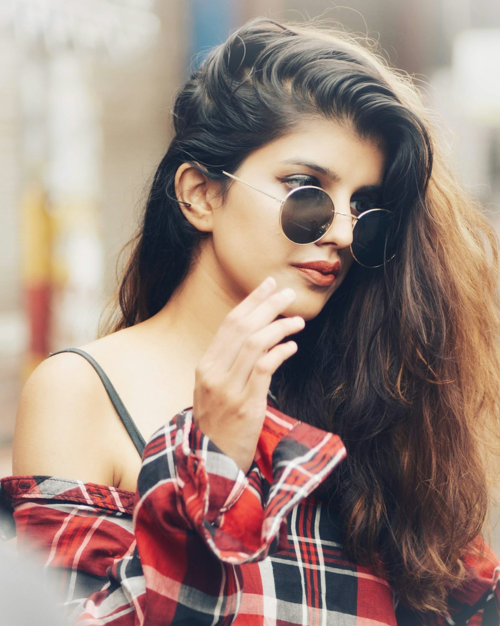 woman in sport shirt with sunglasses