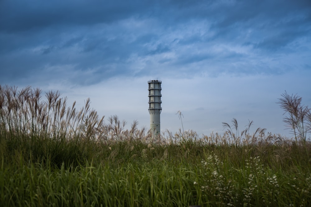 gray concrete tower under cloudy sky