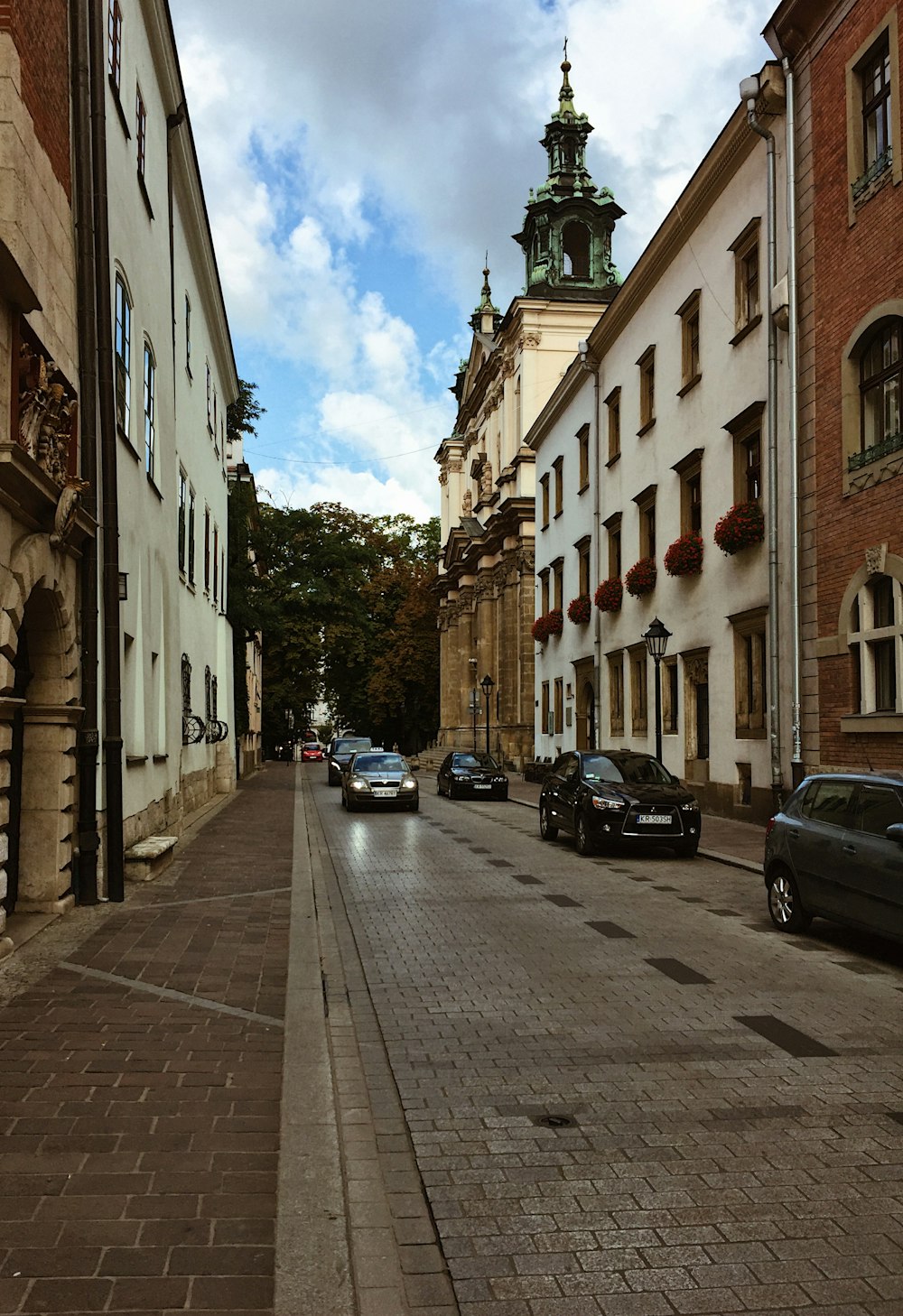 running vehicles near sidewalk