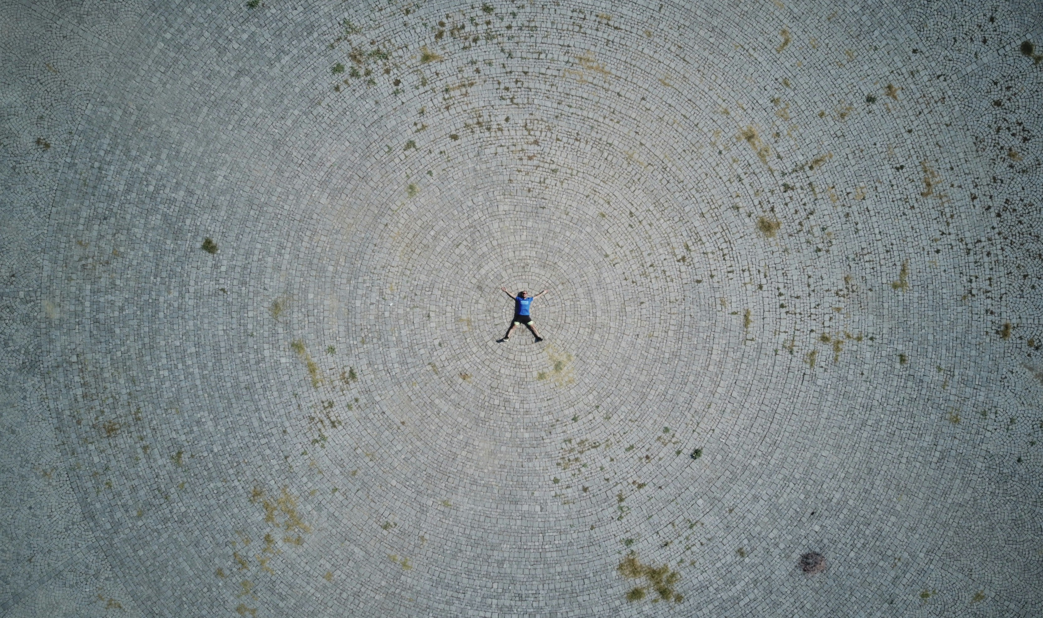 person lying forward on gray field