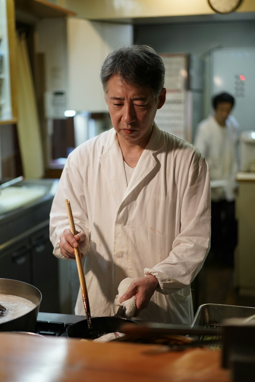 man cooking inside building