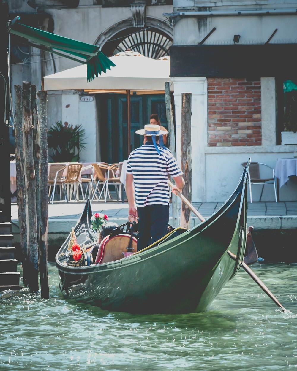 man on boat on Canal