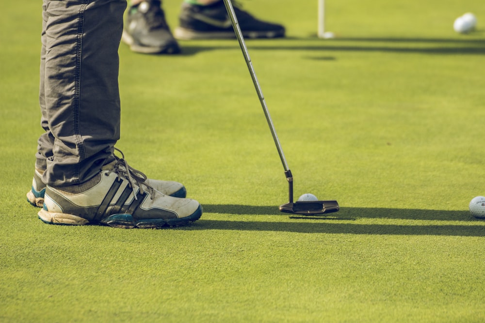 two person playing golf