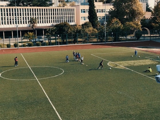 A football field with players practicing.