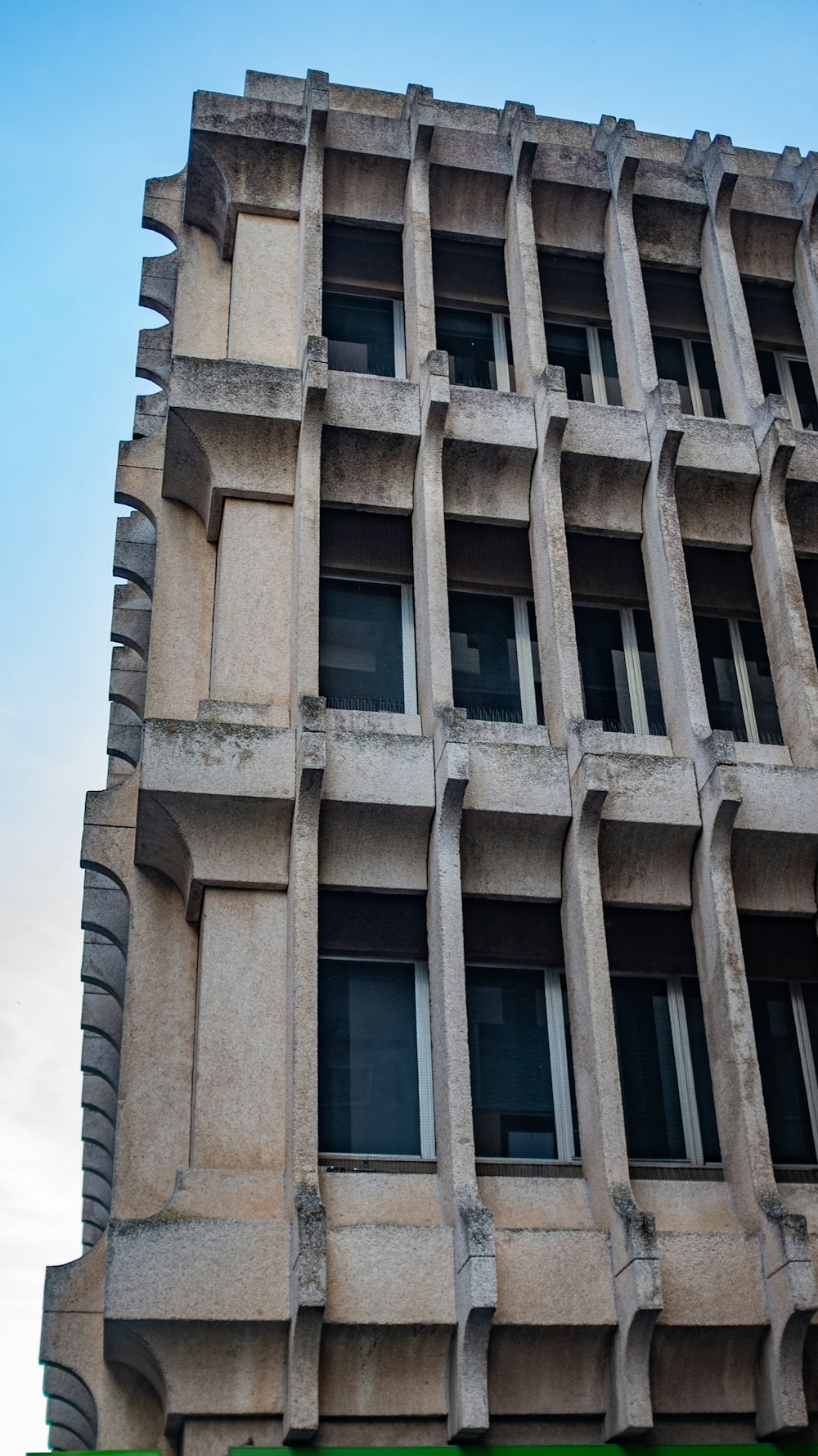 brown 3-storey building during daytime