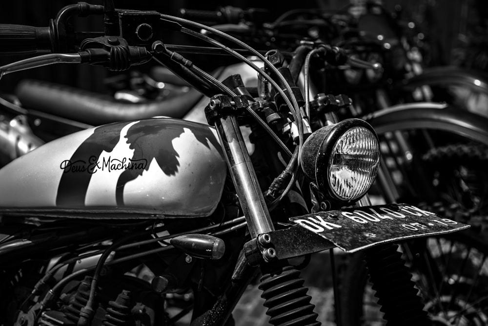 grayscale photo of park standard motorcycles