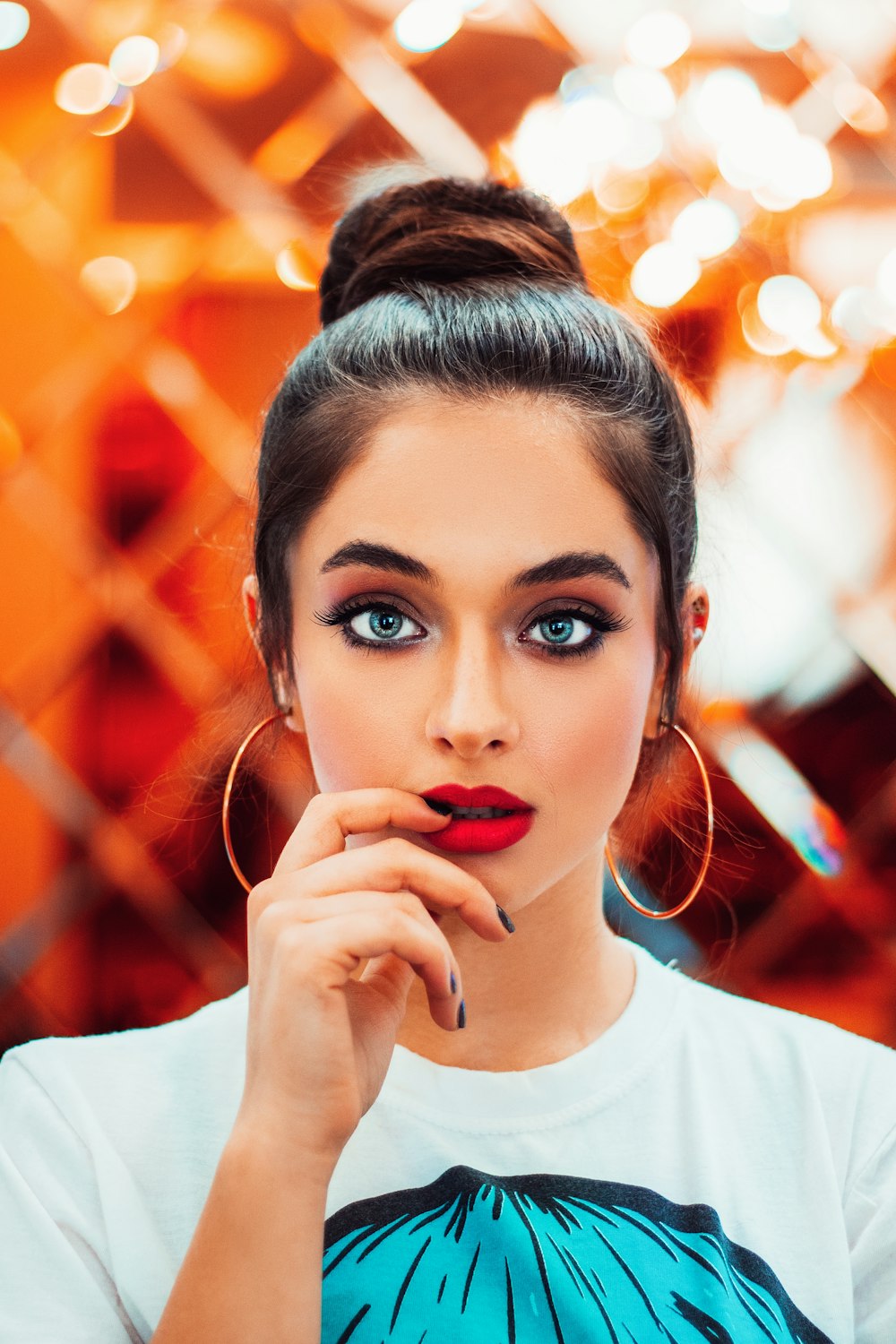 selective focus photography of woman biting right index finger