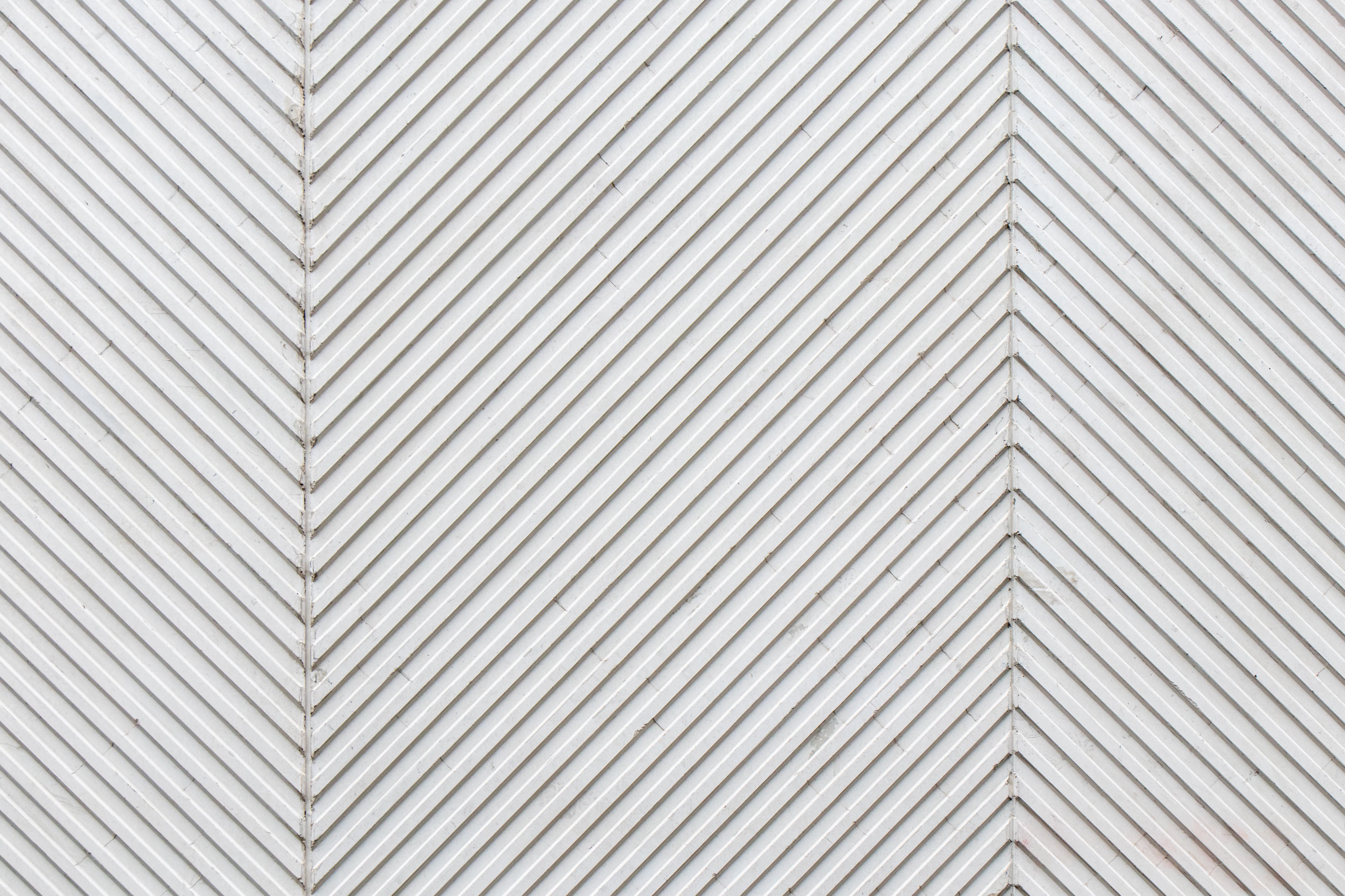 White textured herringbone tile