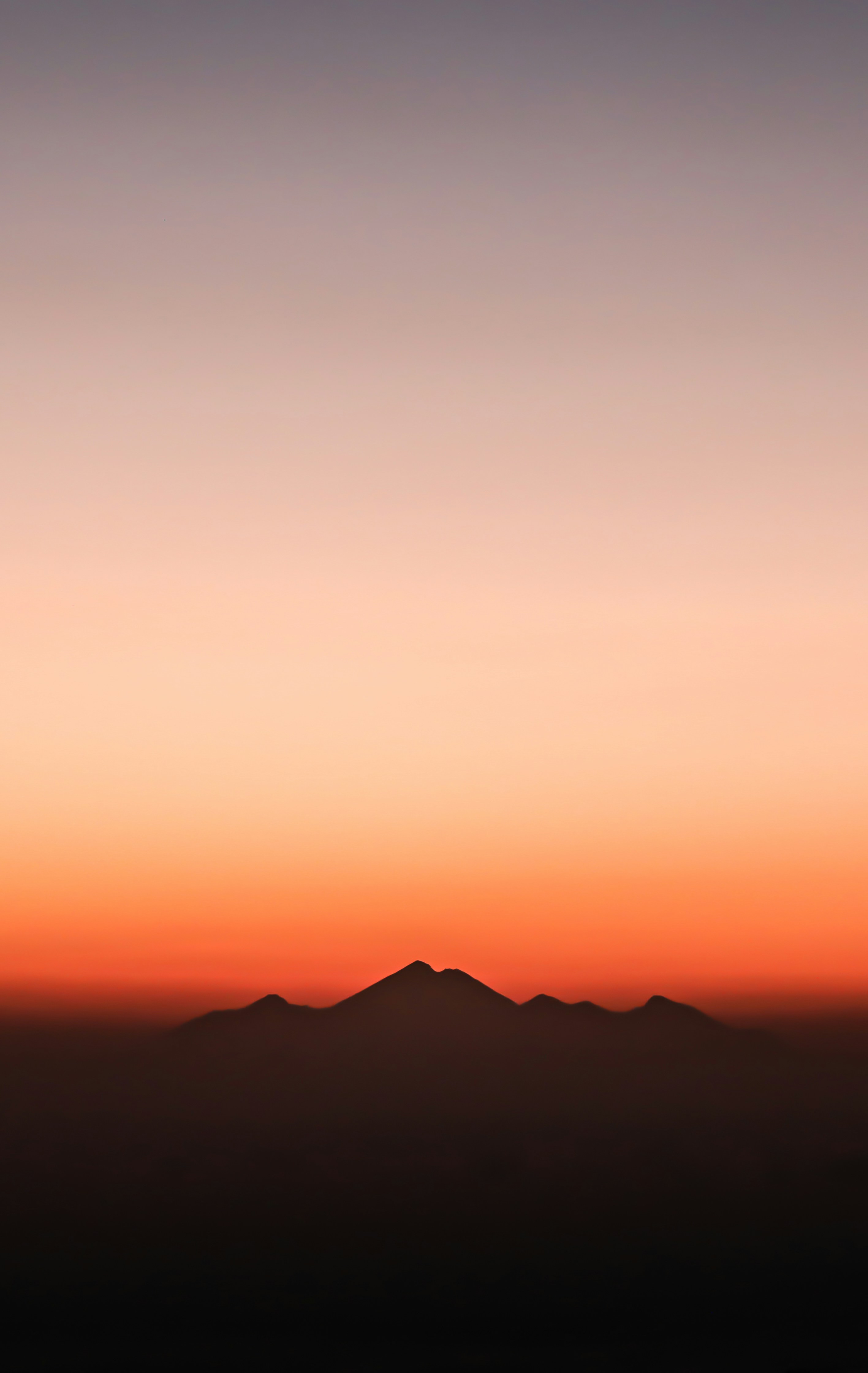 silhouette of mountain during golden hour