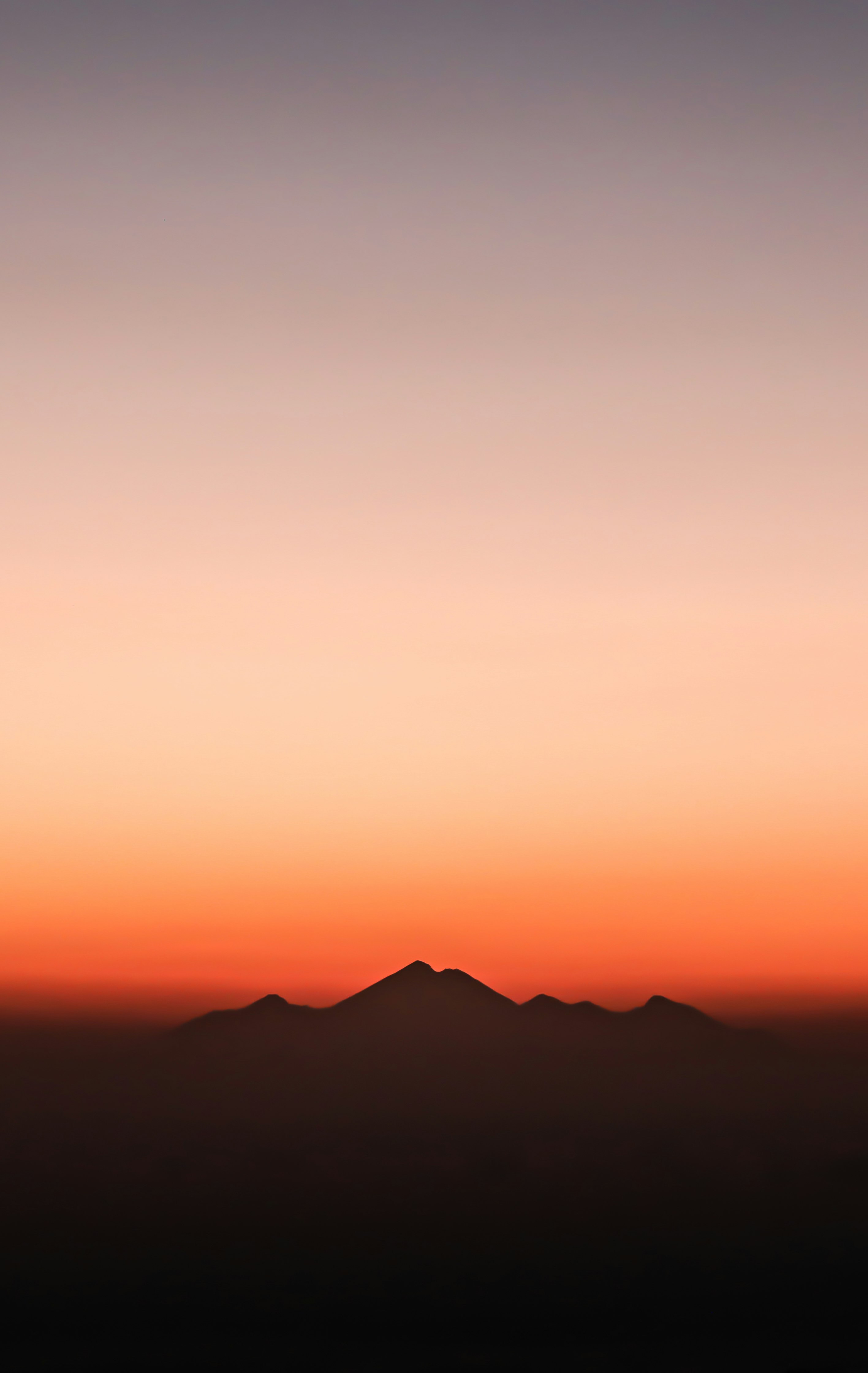 silhouette of mountain during golden hour