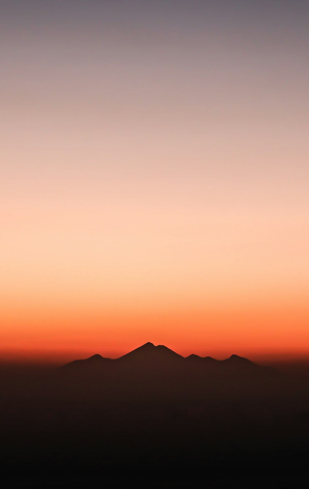 silhouette of mountain during golden hour