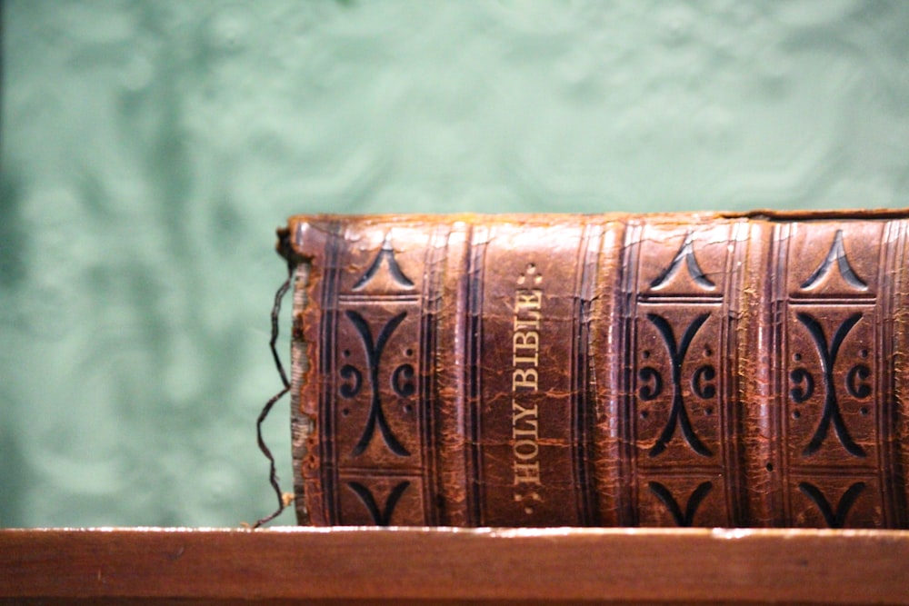 selective focus photography of closed Holy Bible