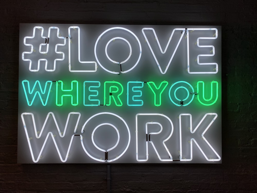 turned-on love where you work neon signage