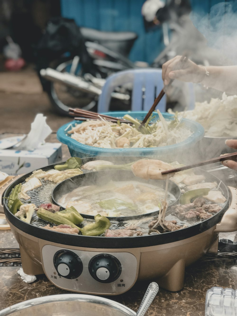 person cooking vegetables