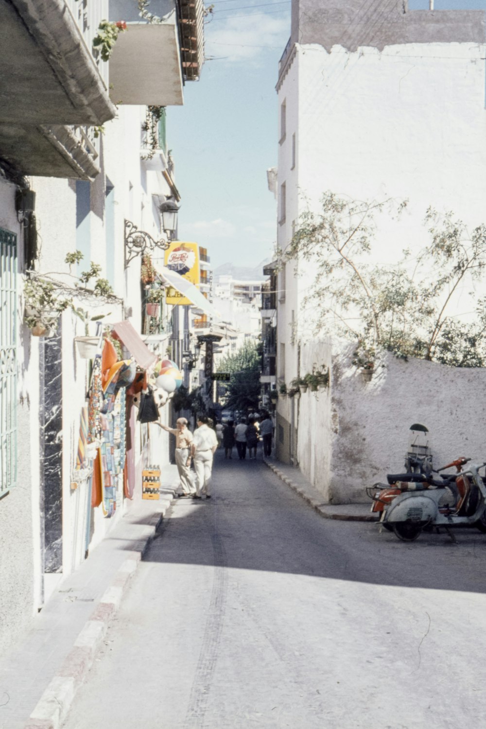 people walking on road near buildings