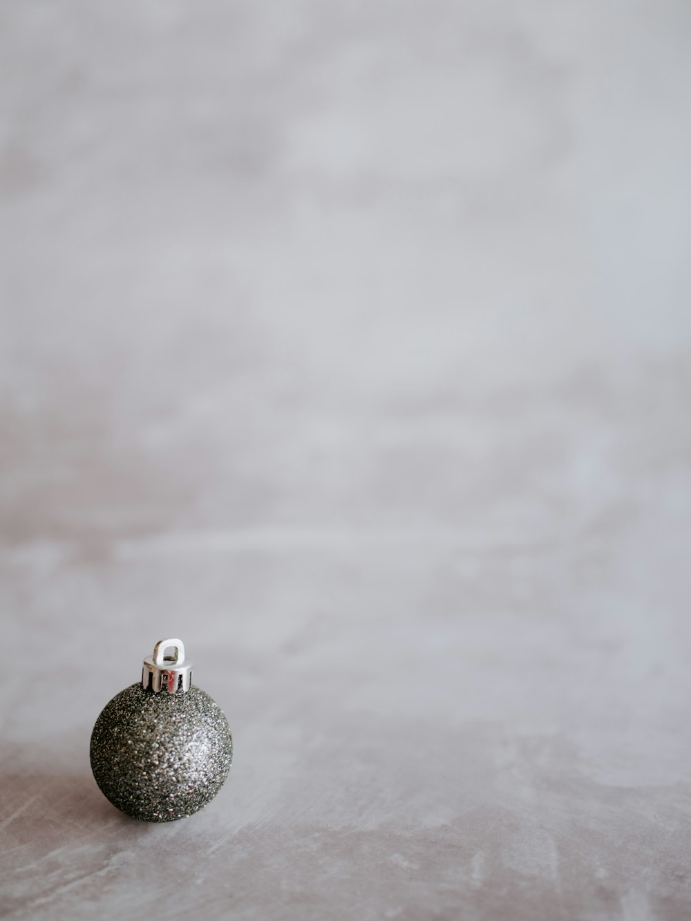 gray bauble on gray surface