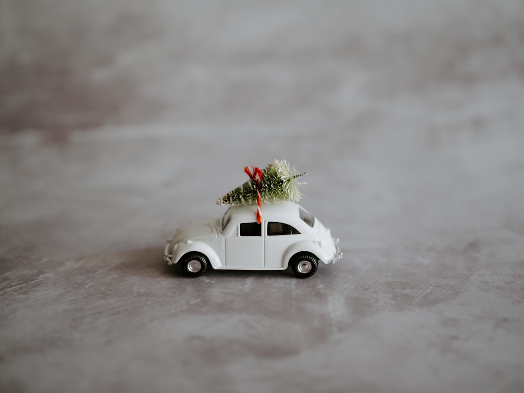 white Volkswagen Beetle toy, Christmas festive VW Beetle with blank negative copy space