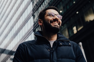 man in eyeglasses and jacket