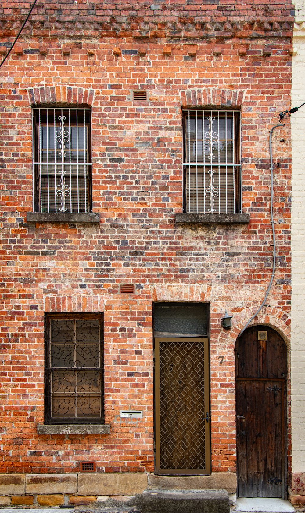 brown brick building with windows