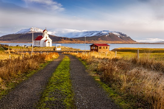 church near house on island in Akranes Iceland