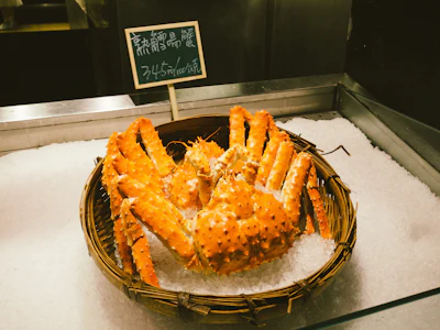 A whole king crab served on a plate at a seafood restaurant