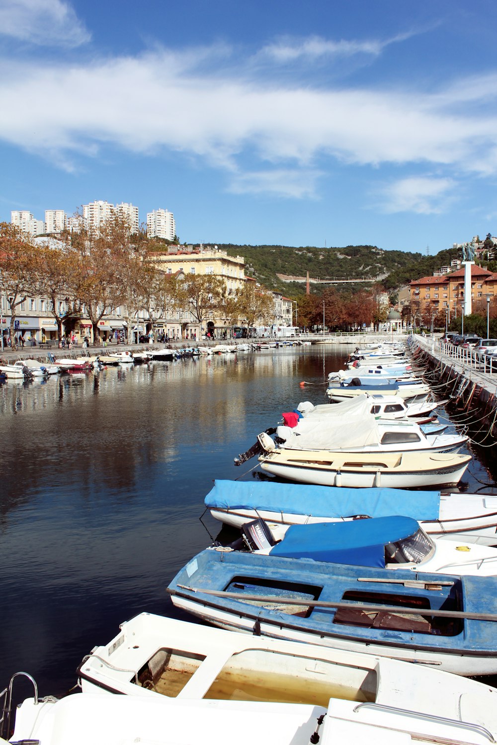 boats docked beside pier during day