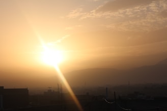 A radiant sunrise casting honey-colored light over a peaceful cityscape, symbolizing hope and new beginnings.