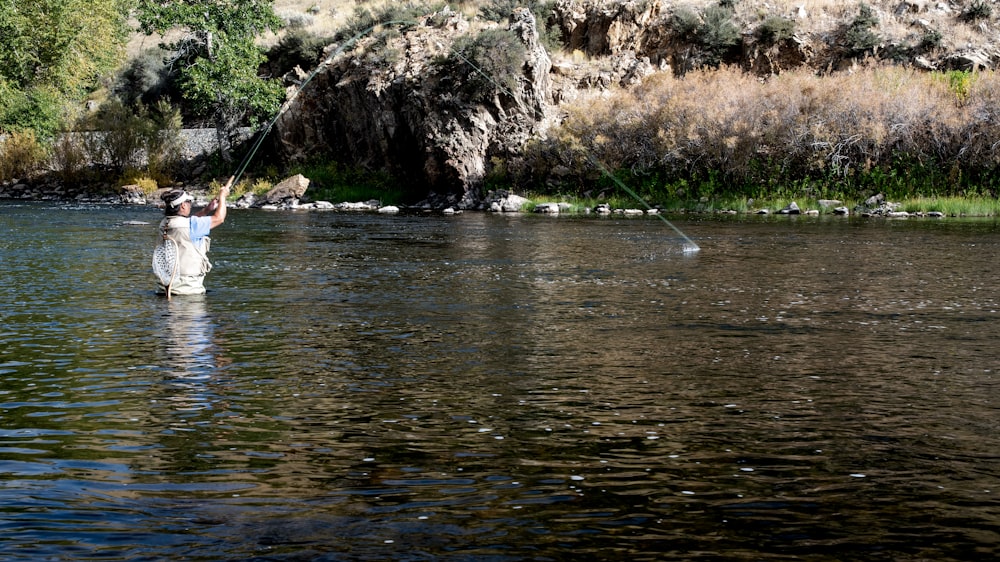 person doing fishing during daytome