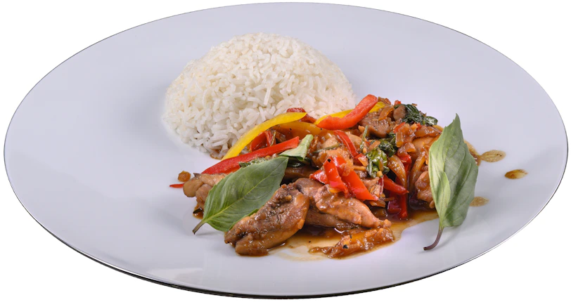 A vibrant plate of pork stir-fry with colorful bell peppers and steamed rice.