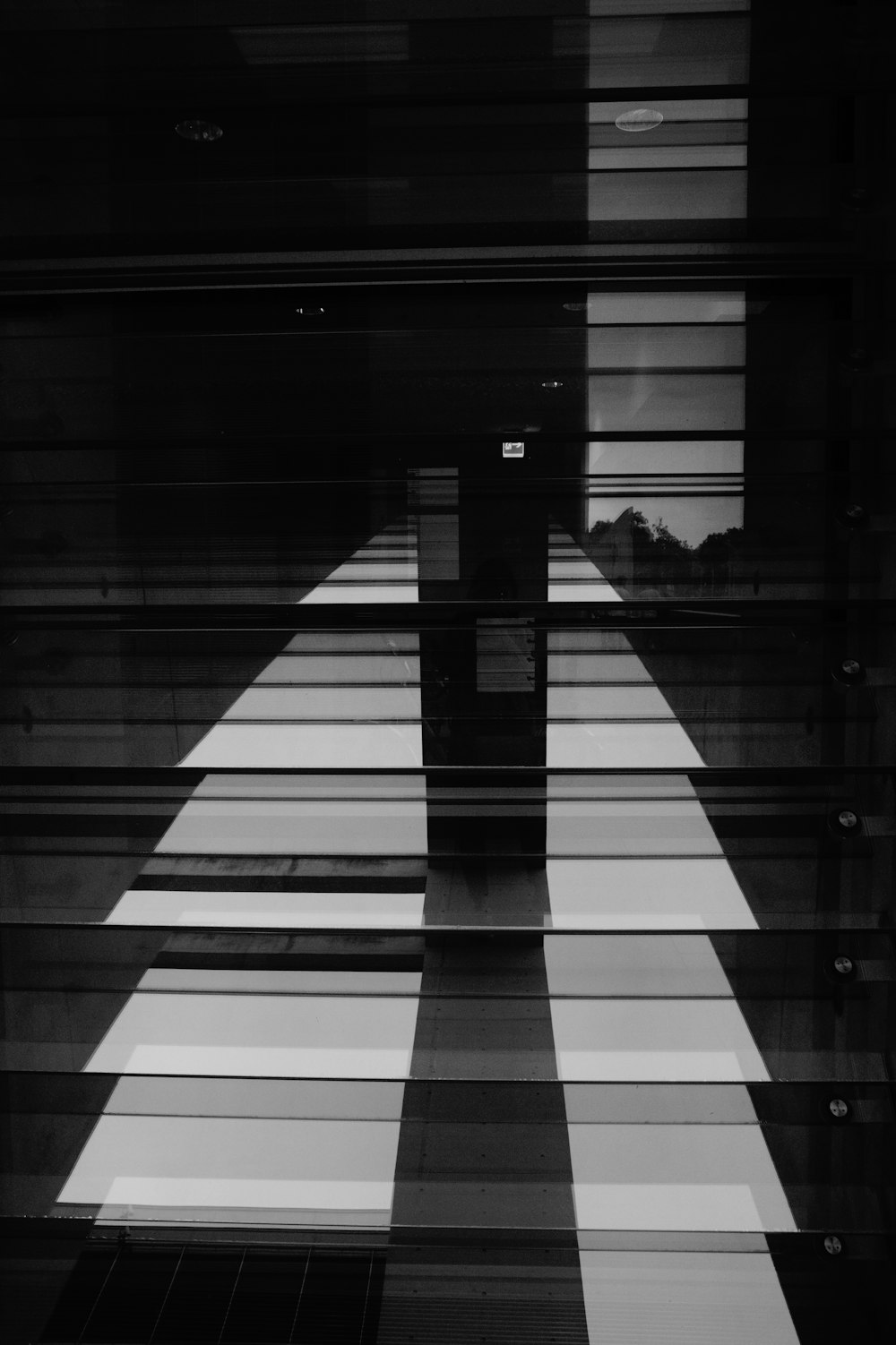 a black and white photo of a checkered floor