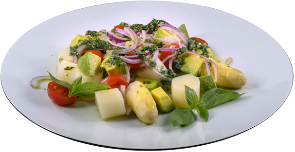 A colorful salad featuring mixed greens, cherry tomatoes, and avocado slices.