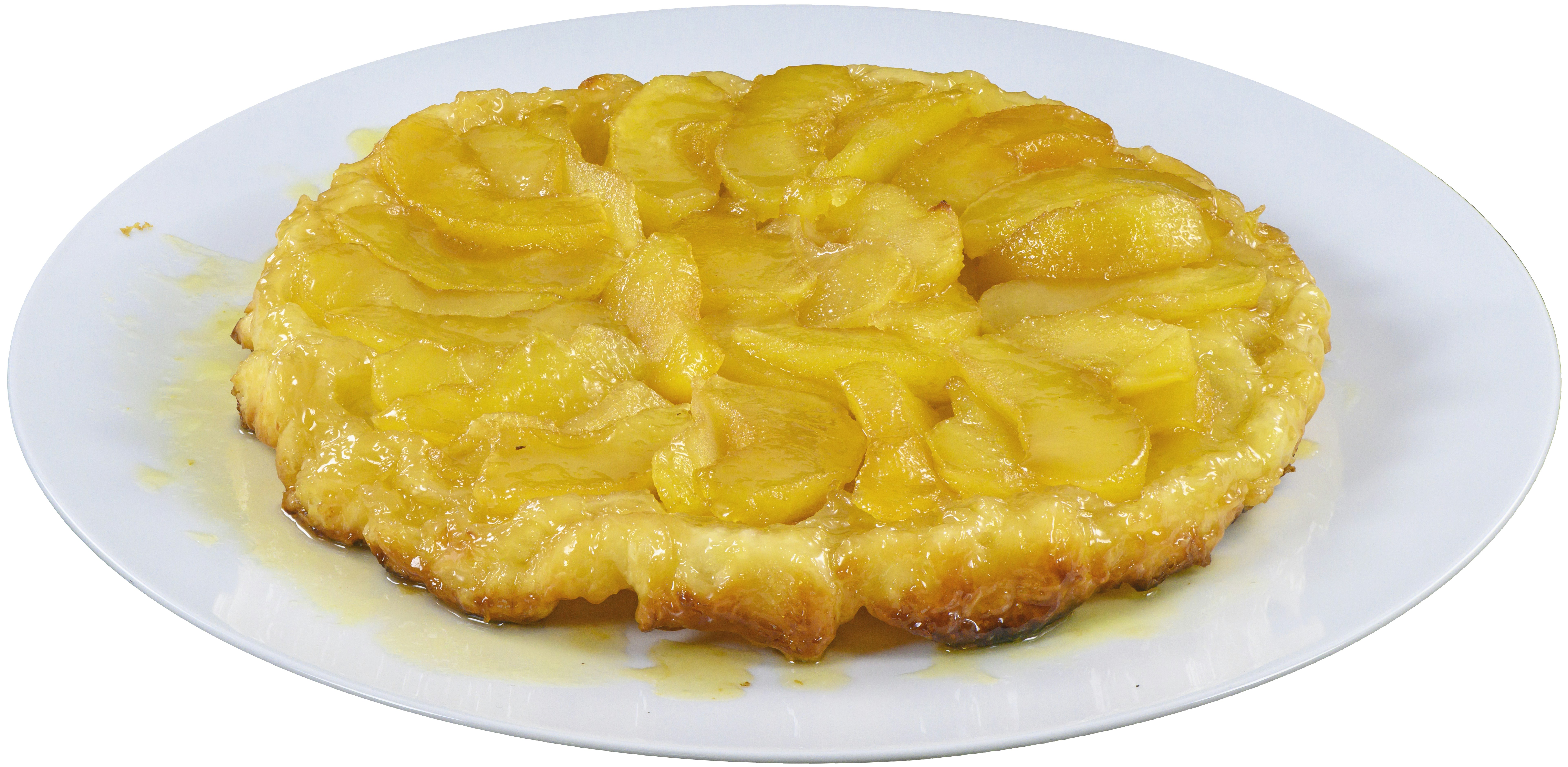 Inverted caramel apple tart with glossy caramel glaze on rustic ceramic plate