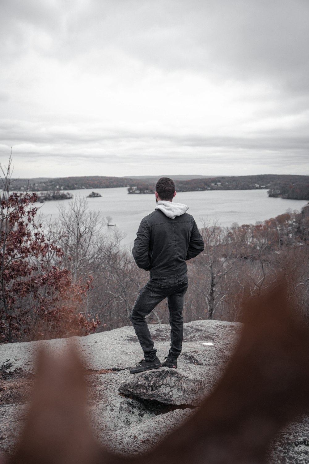 man wearing black jacket and jeans