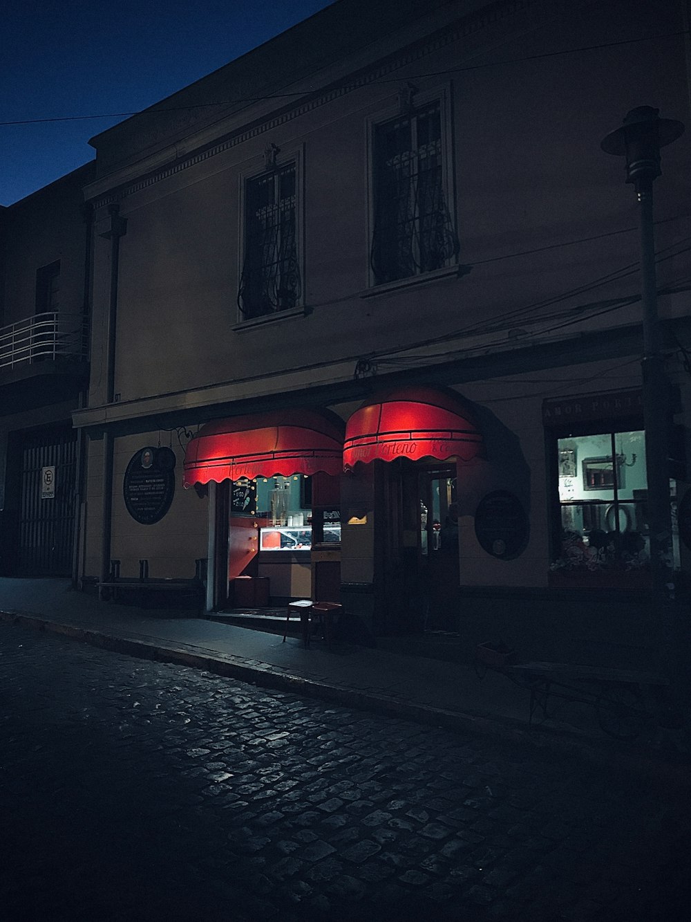 a building with a red light on the front of it