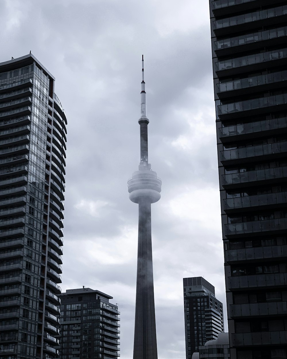 CN tower in greyscale photography