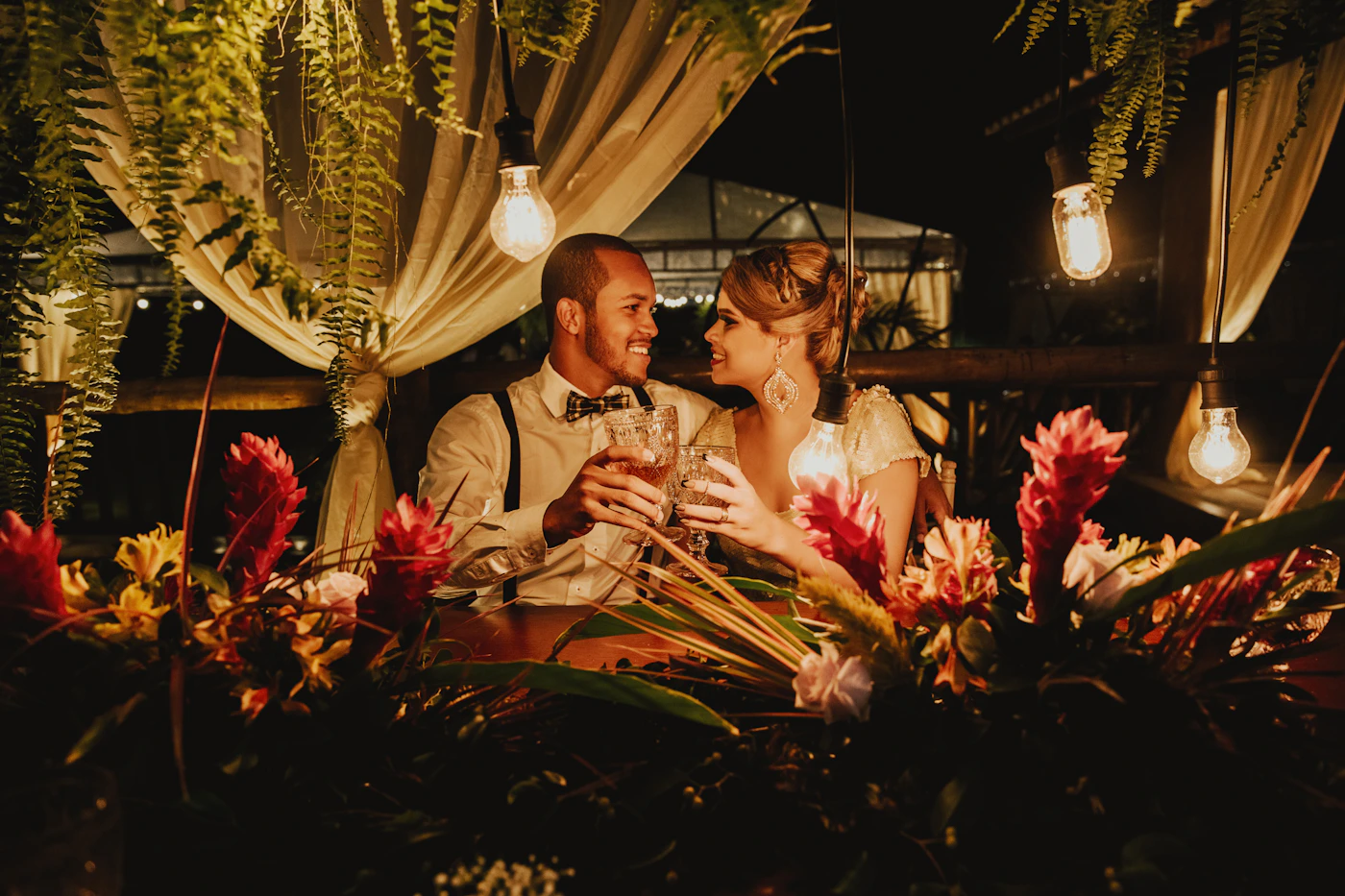 Couple celebrating in the Ecuadorian cloud forest reserve after their elopement ceremony with the mist creating an atmospheric backdrop around the trail