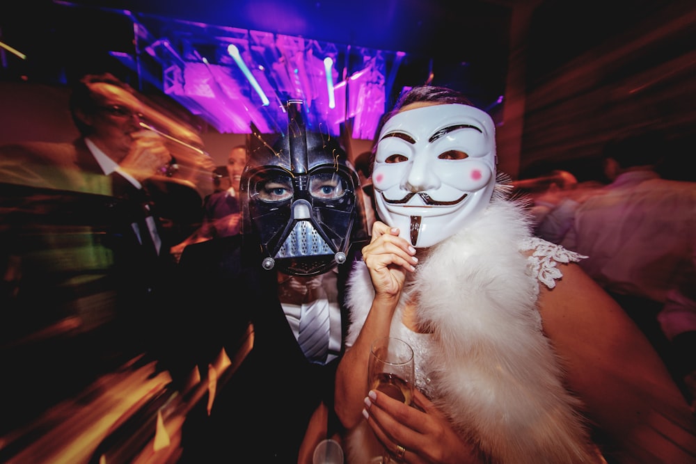 a couple of people that are wearing masks