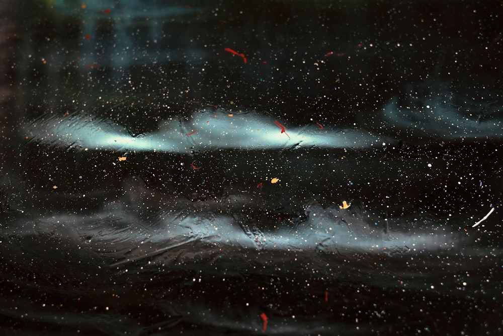 a painting of a sky with clouds and stars