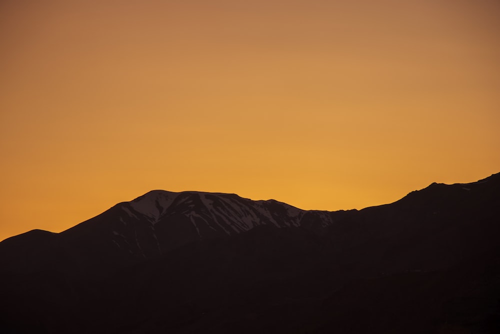 grey mountain during golden hour