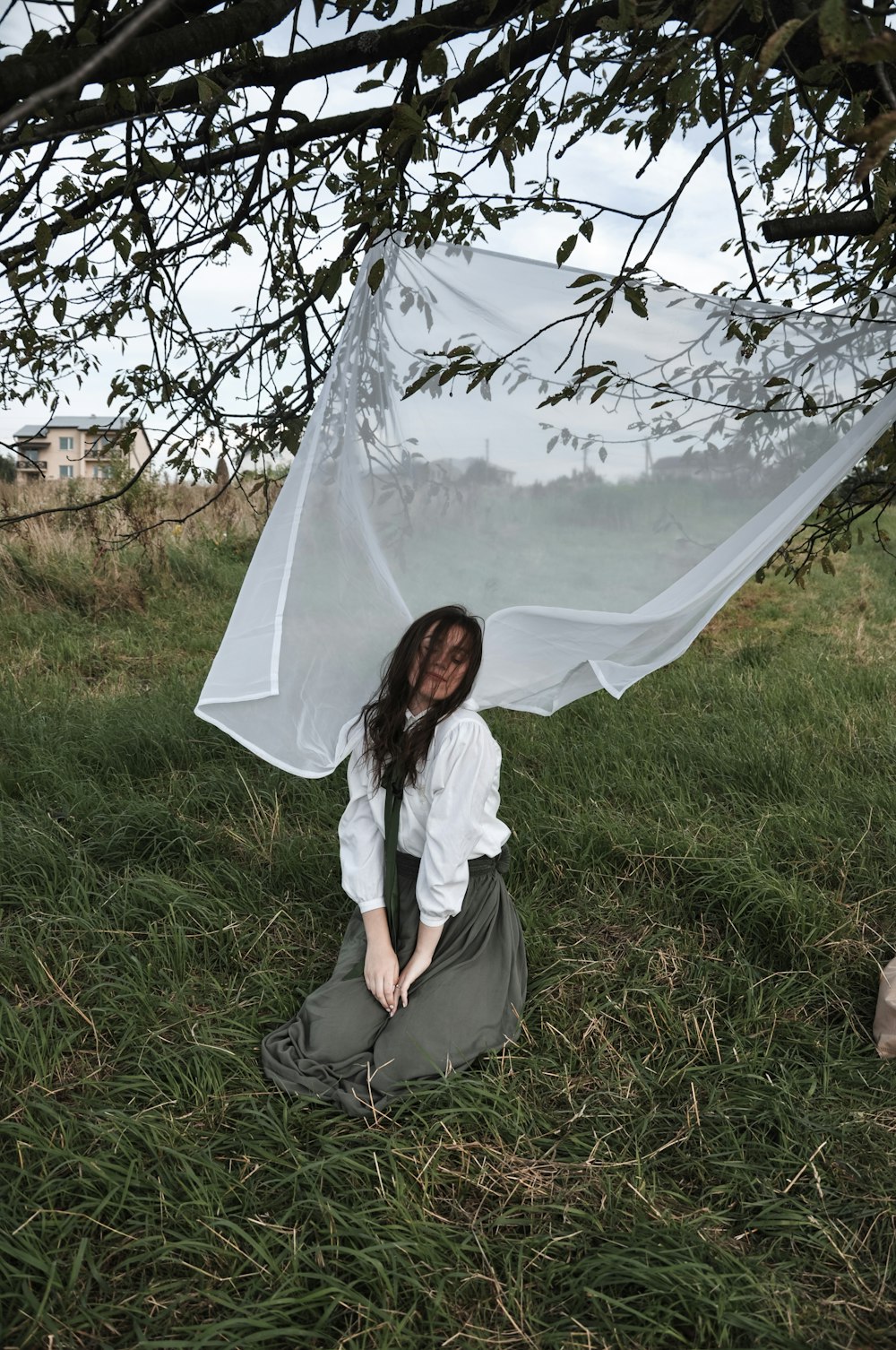 woman kneeling on grass