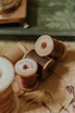 spools with threads on beige surface