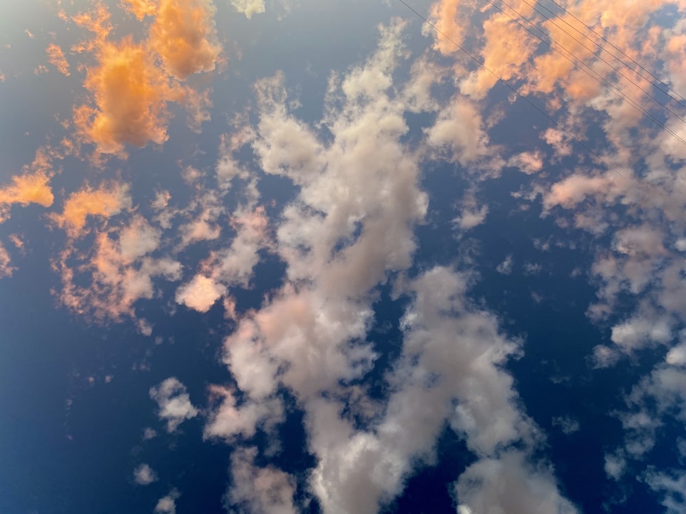 low-angle photography of white and brown clouds