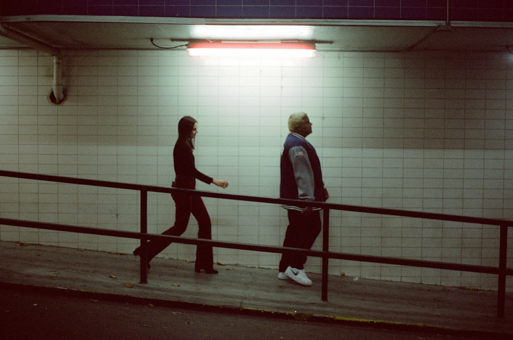 man and woman walking on basement
