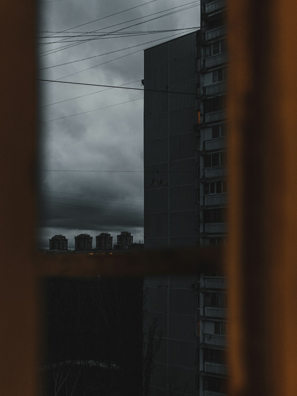 view photography of high rise building during cloudy sky