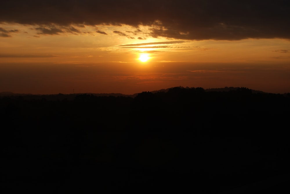 silhouette of mountain during golden hour