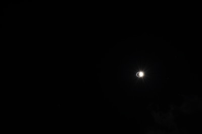 A dynamic shot capturing the sun’s corona stretching into space during an eclipse.