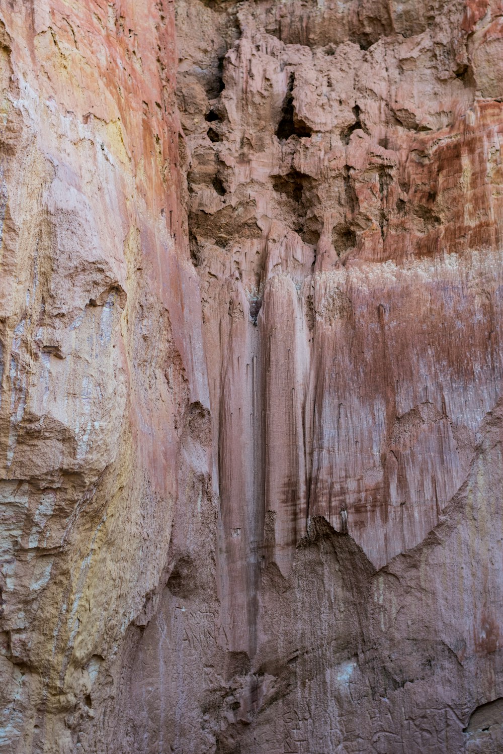 a group of people standing in a canyon