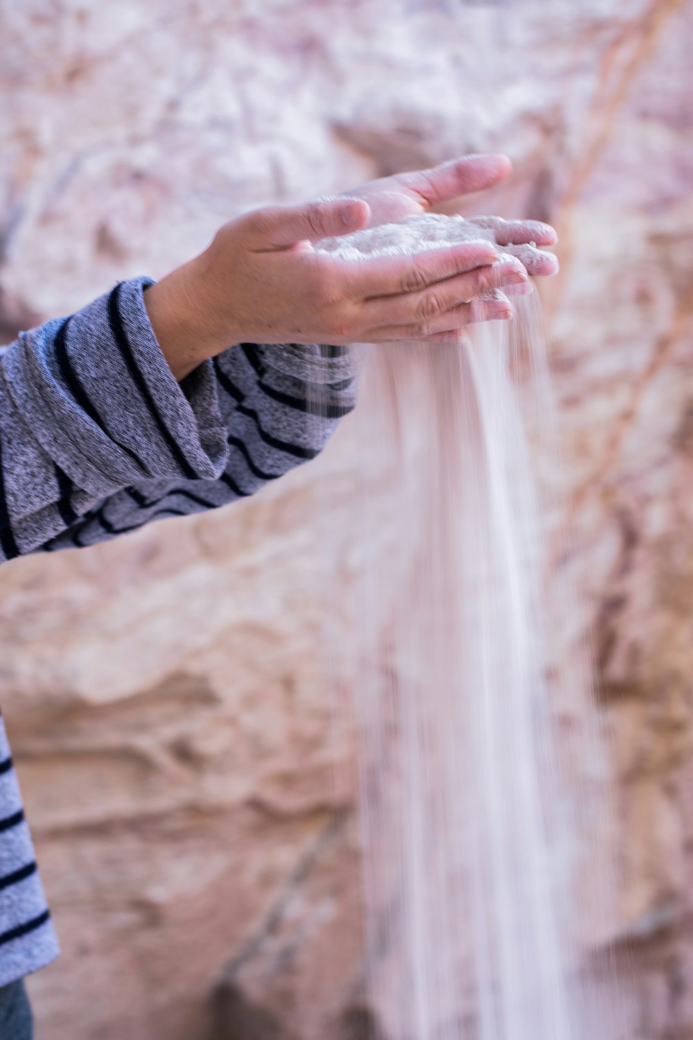 person holding white powder